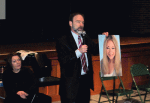 Joel Feldman at Medford H.S. holding a picture of his daughter as he tells the students that he drove distracted before Casey's death