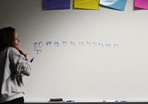 Mitchell Watts, 15, during a cognitive distracted exercise at Longmont High School. She erred while counting backwards from 100 while talking on the phone with her friend, Yolanda Leon-Duarte. ( Greg Lindstrom/Times Call )