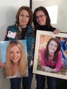 Dianne Anderson (L) holding a picture of her daughter Casey Feldman and Liz Catherman with a picture of her daughter