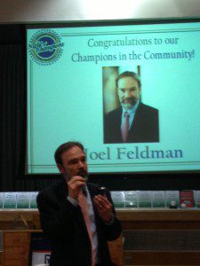 Joel Feldman speaking at Magee upon receipt of the Champion in the Community Award