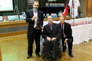 Joel Feldman (L) poses with Magee's Mark Chilutti and Jack Carroll, Magee's President and CEO (R) and his Champion of the Community Award