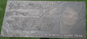 The USFW Kelson Vaillancourt plaque on the Vaillancourt-Schneck Memorial Nature Trail 