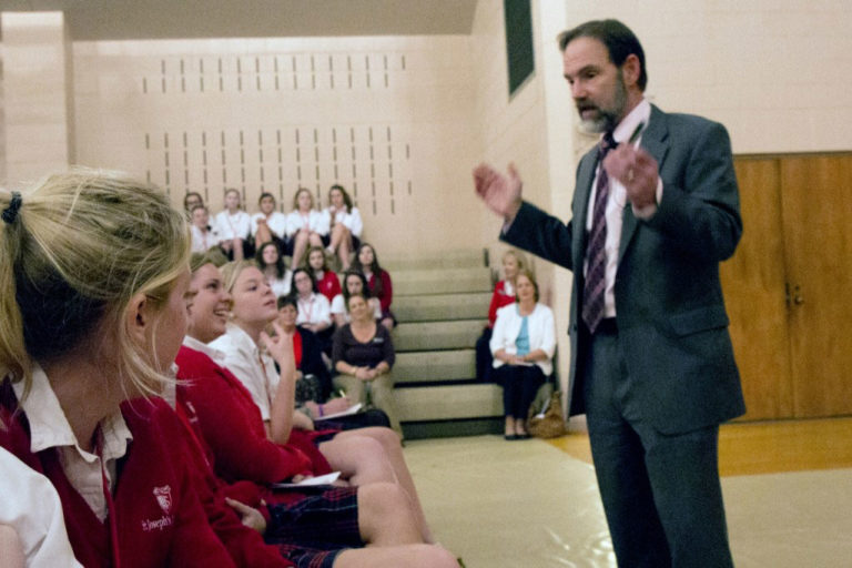 Joel Feldman talking to students