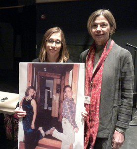 Emily Stein (left) with her mother Julie holds a photo of her father Howard who was killed by a distracted driver in 2011. Tuesday morning, Emily spoke with Groton-Dunstable high school students about the dangers of driving while distracted by electronic devices. Photo by Bob Stewart.