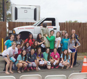 Students viewed a mock roll-over with a dummy who was not wearing a seatbelt.