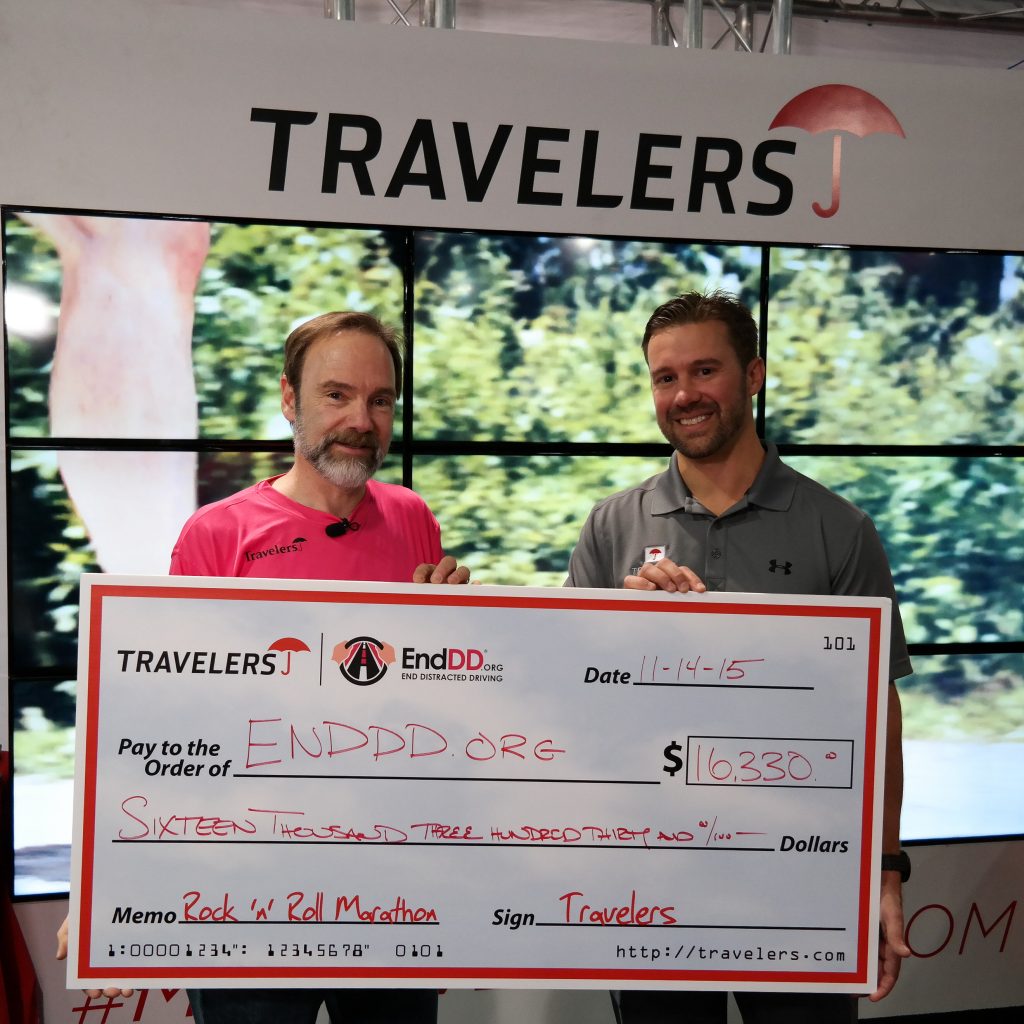 Joel Feldman receives the check for EndDD.org from Gary Griffin, Travelers Insurance Company in Las Vegas